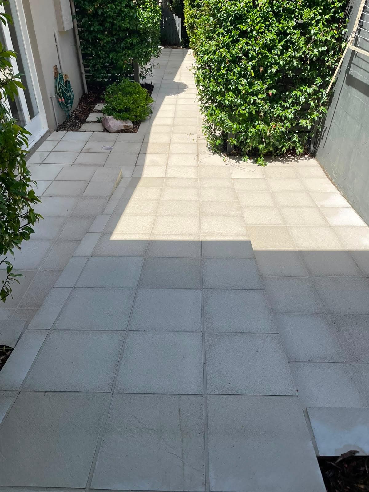 Tiled path after cleaning, bright and consistent in colour